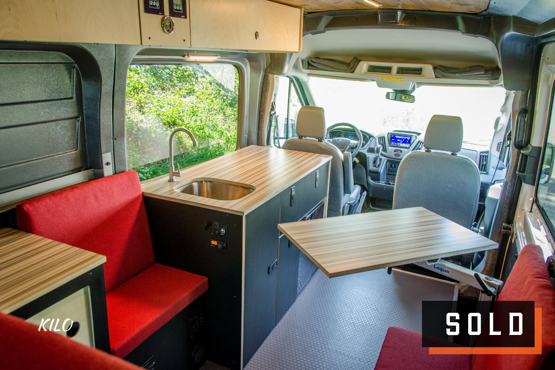 Look inside of 4x4 Ford Transit Campervan for sale built by Axis Vehicle Outfitters in Portland, Oregon